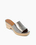 A metallic silver open-toe mule with a smooth leather upper, a wooden block heel, and a tan insole. 8