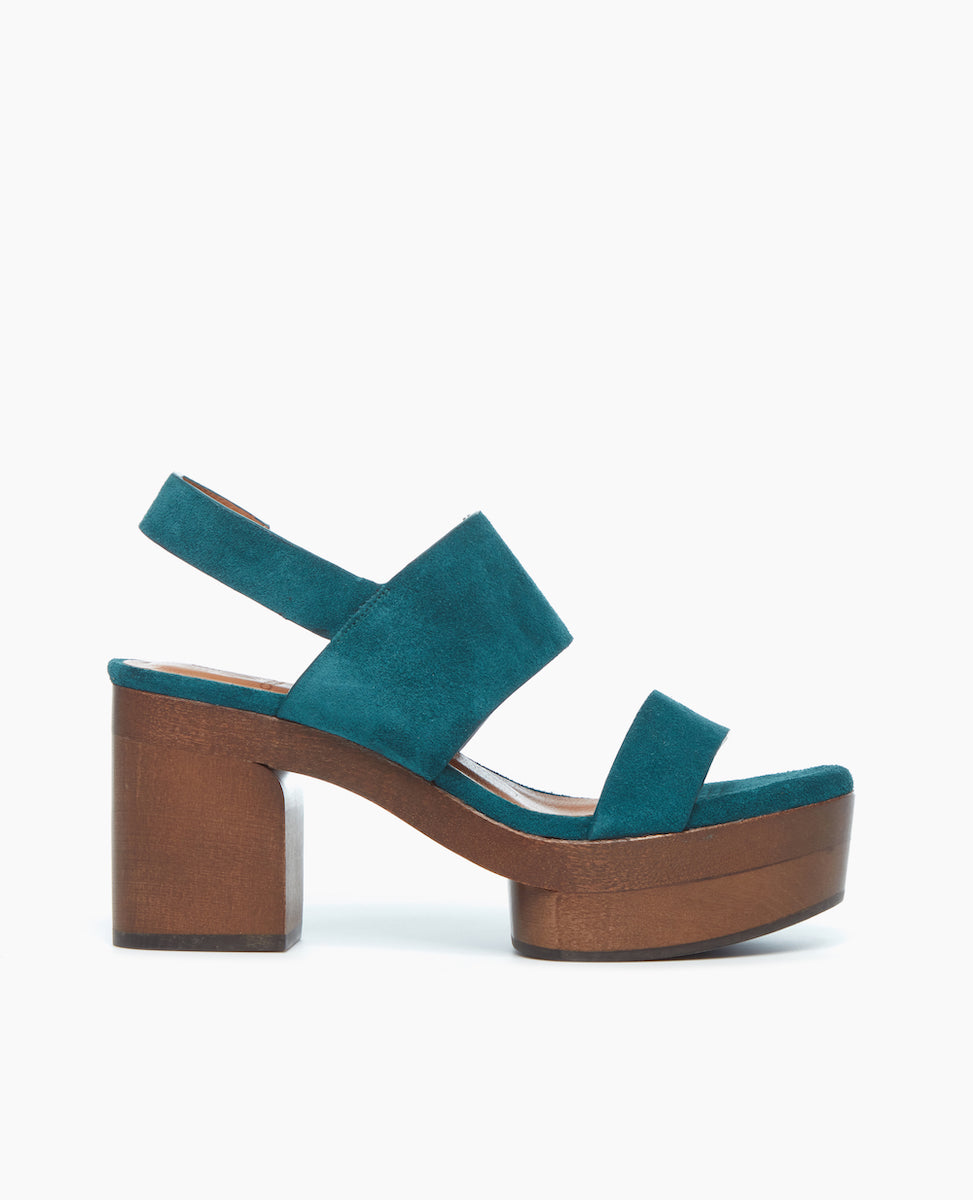 Side view of the Oca Clog in Azure Split Suede featuring two parallel straps that flatter the foot and a slingback for a secure fit