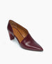 A sleek, maroon, pointed-toe high heel shoe with a glossy finish, featuring a cut-out side design, a sturdy block heel, and a tan insole. 5