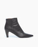 A sleek, black leather ankle boot with a pointed toe, a side zipper, and a mid-height, tapered heel. 7