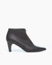 A sleek, black leather ankle boot with a pointed toe, tie-closure, and a mid-height, tapered heel. 2