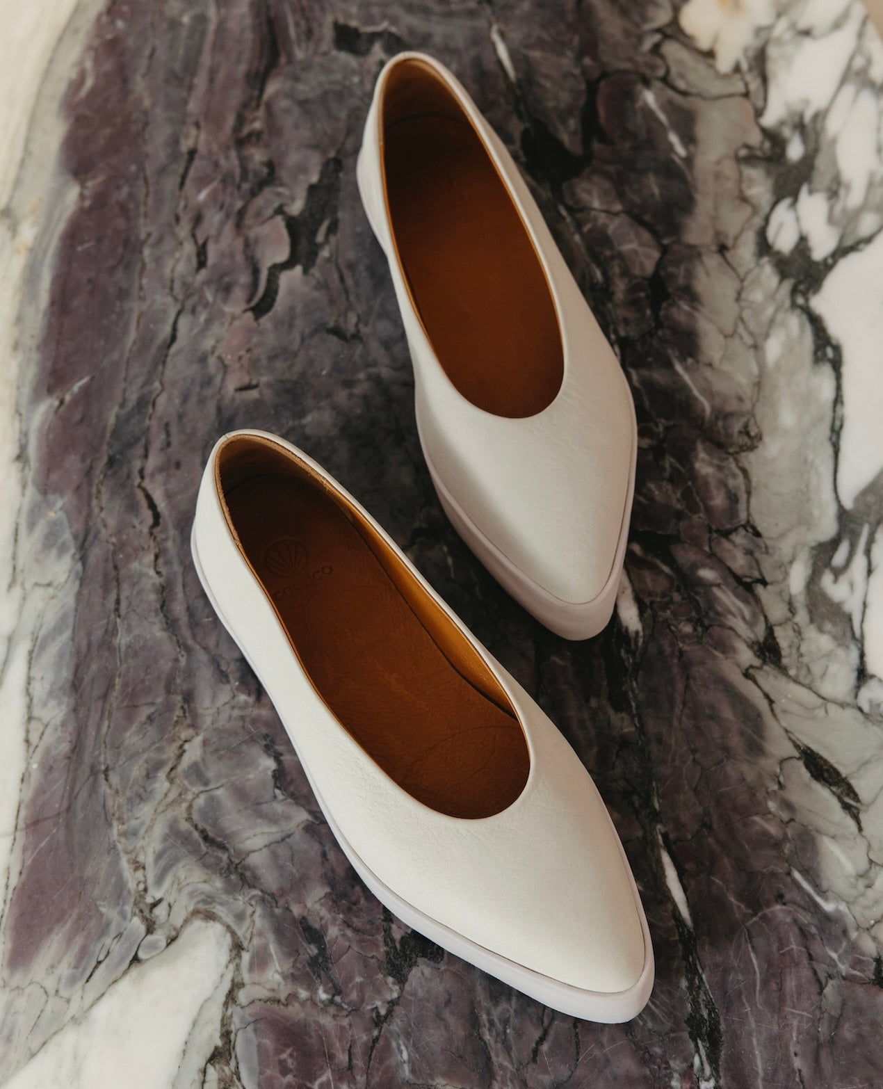 Regal Sneaker in greige from the top on a marble background