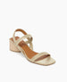 The Sterling wood heeled, strappy sandal in champagne metallic suede, angled view 4