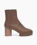 Coclico Travis Boot in Taupe. Side view featuring formed squared toe and balanced with a platform Inside zip closure.  1
