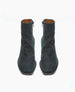 A pair of dark green, mid-calf leather boots with a smooth texture, side zippers, and a slightly pointed toe. 6