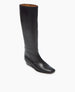 A sleek, black leather knee-high boot with a smooth texture, a slightly squared toe, a low wedge heel, and a tan interior lining. 5