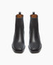 Sleek black leather ankle boots with a smooth texture, squared toes, a low block heel, and pull tabs at the back. 3