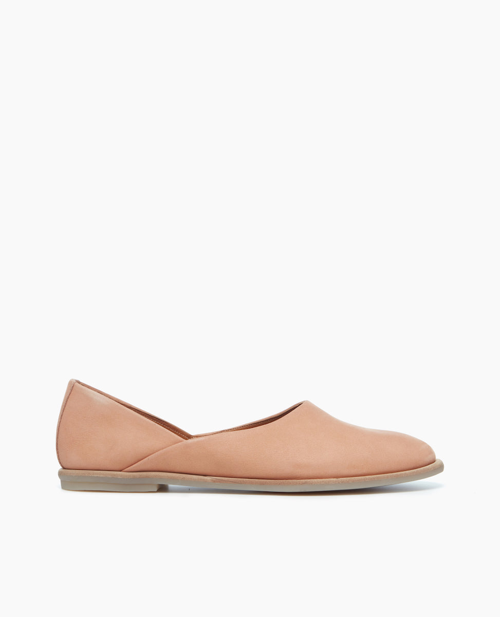 Side view of the Yen Flat in Faun with a high vamp and rounded toe.