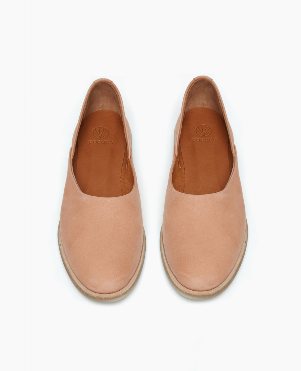 Front view of the Yen Flat in Faun with a rounded toe and high vamp.