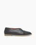 Side view of the Yoko Flat in Deep Sea leather with a high vamp and criss cross feature. 1