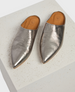 A pair of sleek, metallic silver mules with a pointed toe design, featuring a smooth, shiny leather texture and a tan leather insole with a subtle logo imprint. 3