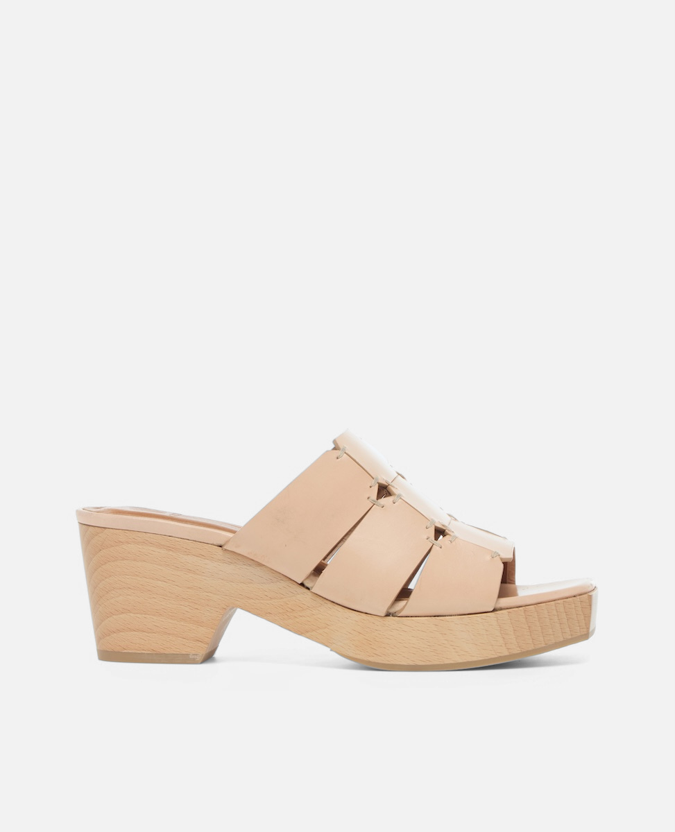 Side view of a clog sandal in natural leather featuring linked straps, wooden heel, and open toe slip-on design
