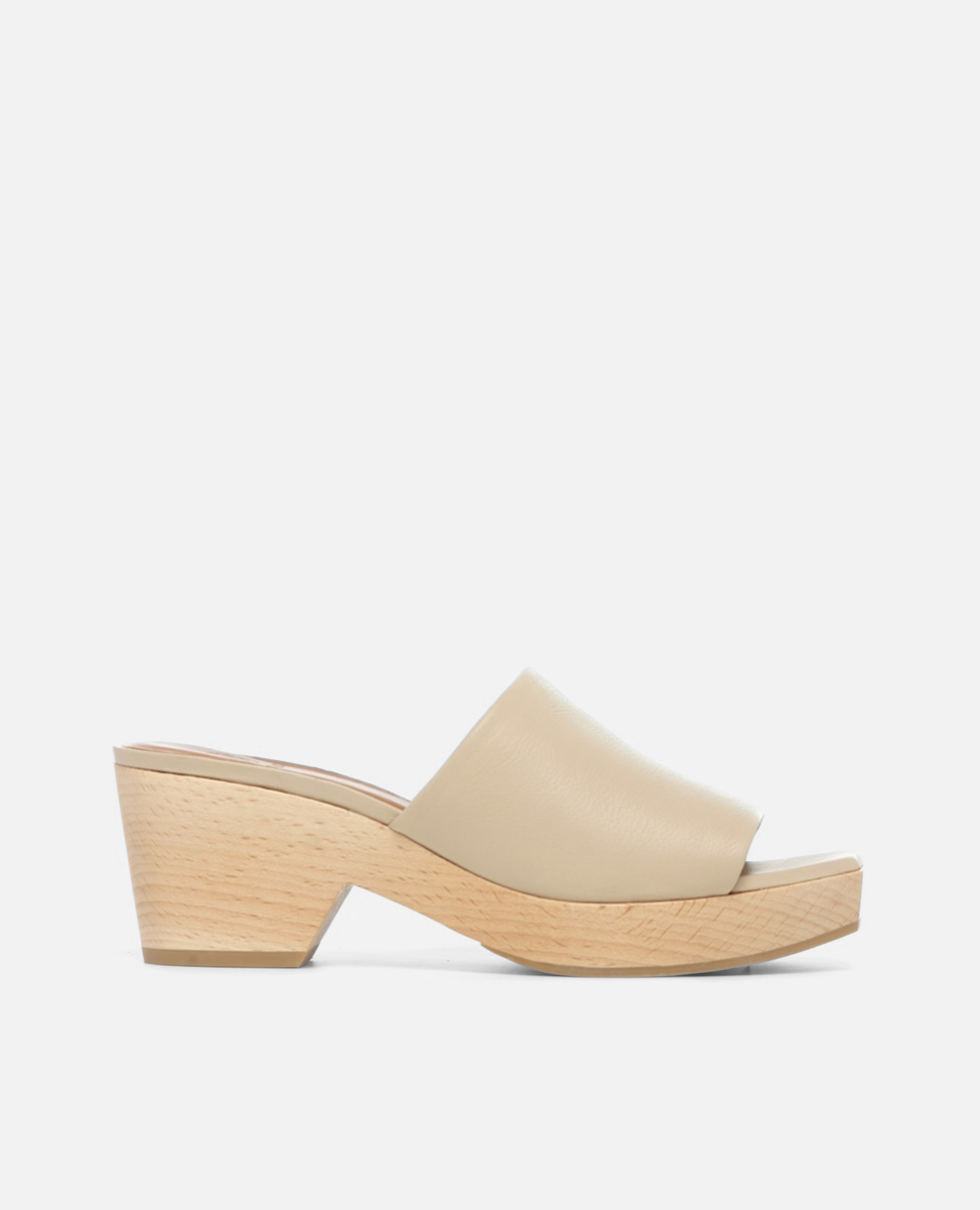 A beige, open-toe mule sandal with a smooth leather upper and a chunky, light wooden block heel.