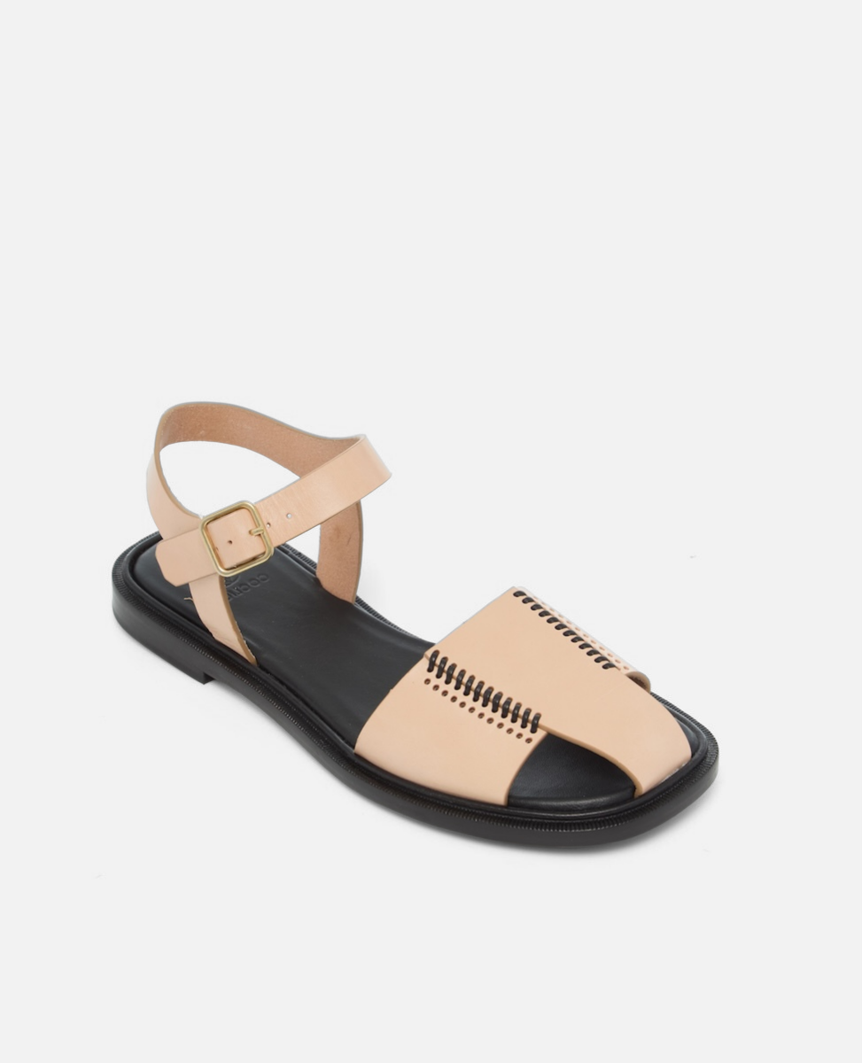 Angled view of a natural leather fisherman sandal with stitched banded straps, slim ankle strap, and a black flexible leather sole with textured welt on a white background.
