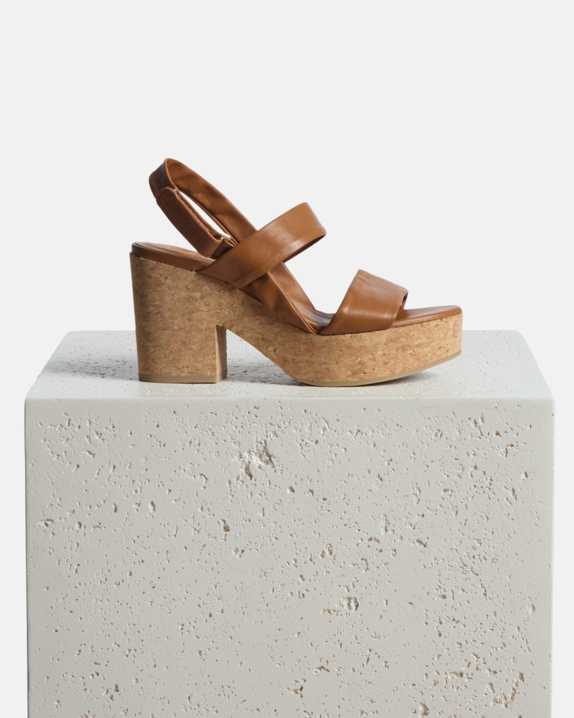 Shoe on a Pedestal: A cuoio nubuck leather platform sandal with tubular straps, adjustable velcro slingback, and cork platform sole