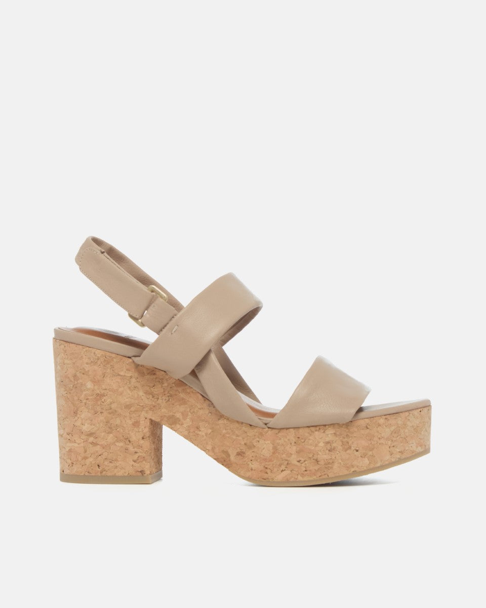 Side view of a grey leather platform sandal with tubular straps, adjustable velcro slingback, and cork platform sole.