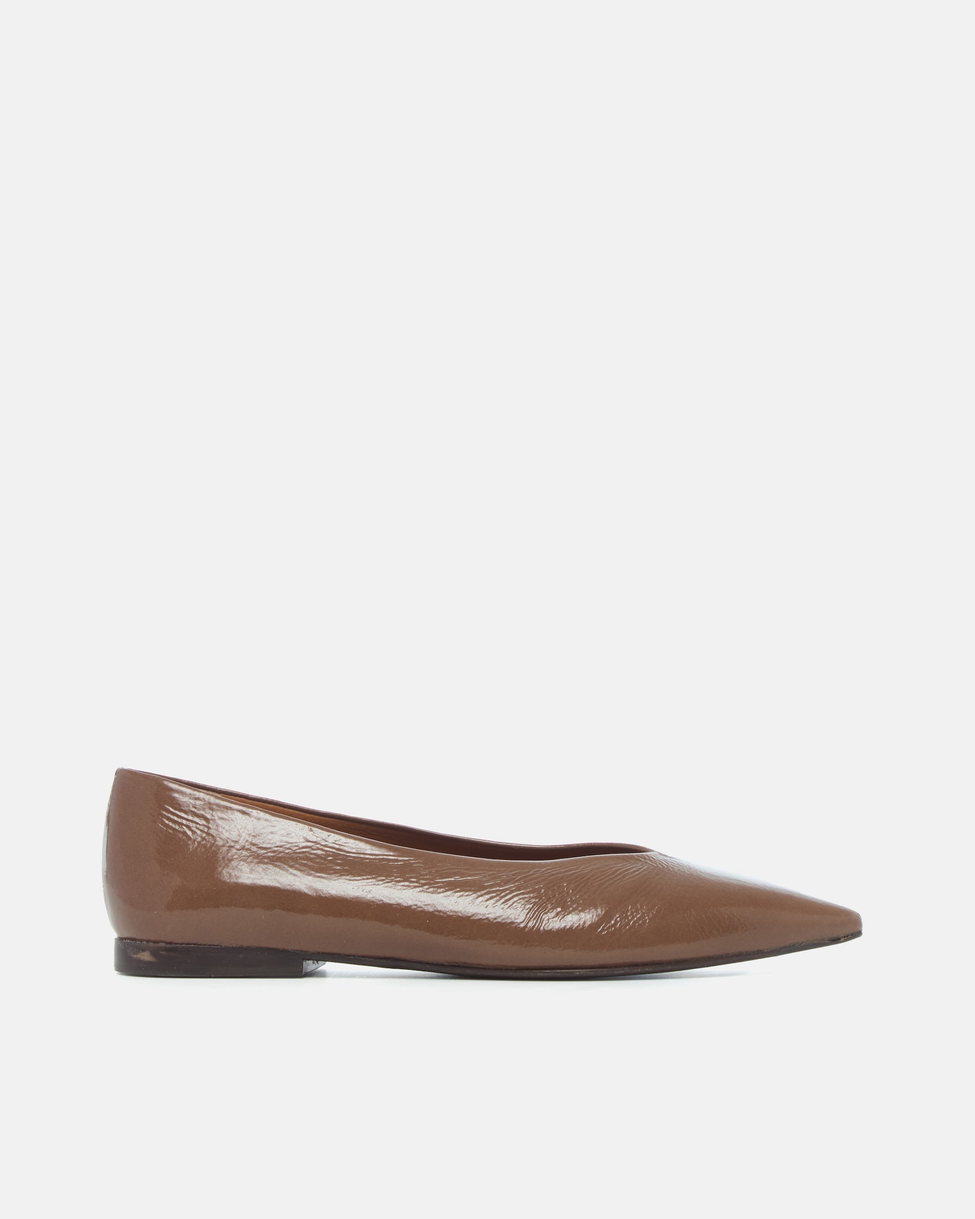 Brown patent leather pointed-toe flat shoe on a light grey background