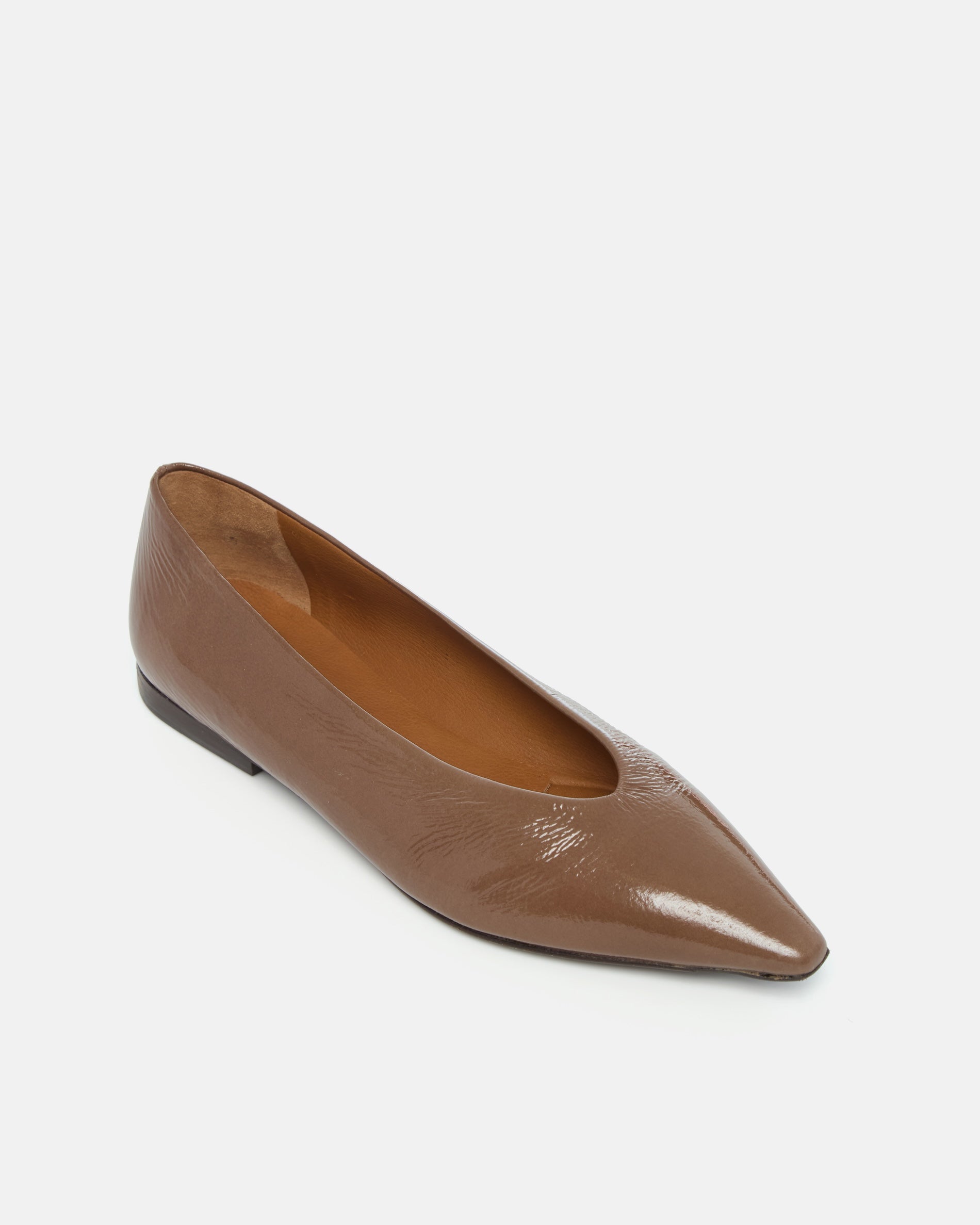 Brown patent leather pointed-toe flat shoe on a light grey background
