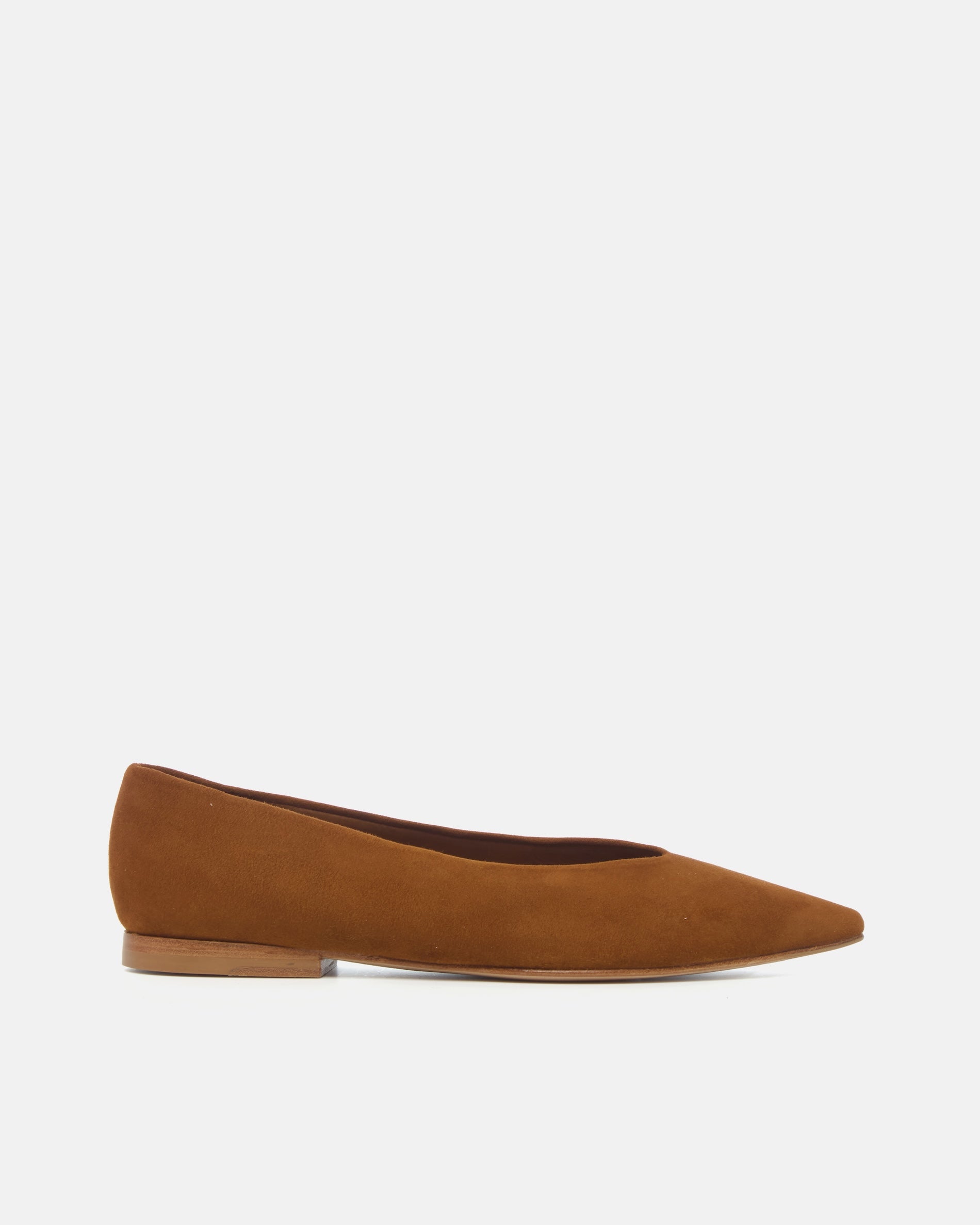 Side view of a warm brown suede pointed-toe flat with clean lines and a flexible leather sole, on a white background.