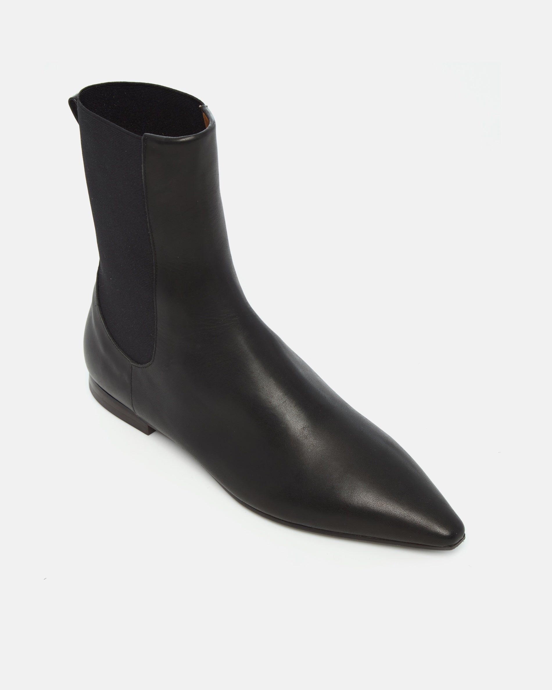 Coclico Cad Boot in black leather, angled view showing elastic side gore and pointed toe