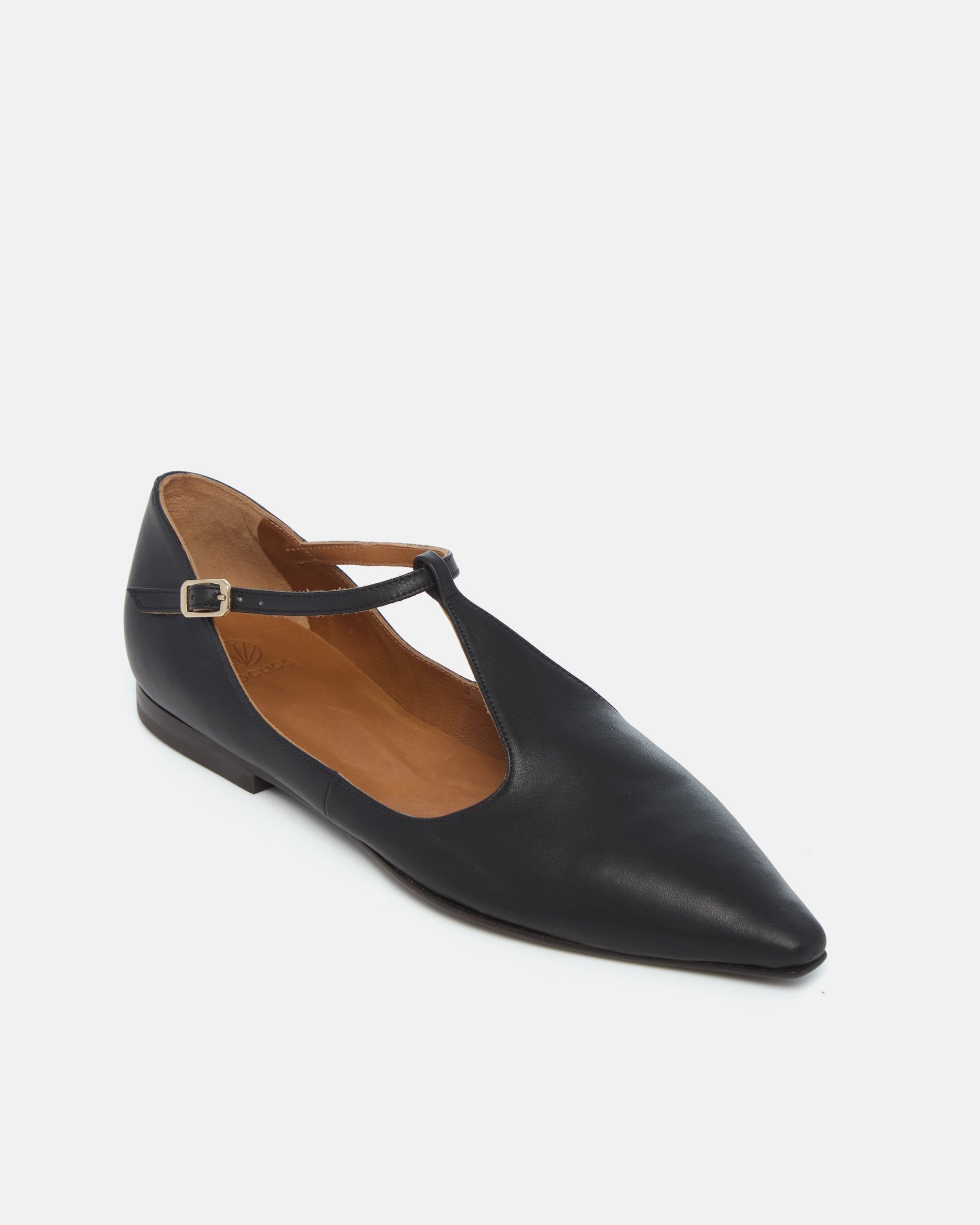Coclico Celeste T-Strap Flat in black leather, angled view of the T-strap detail