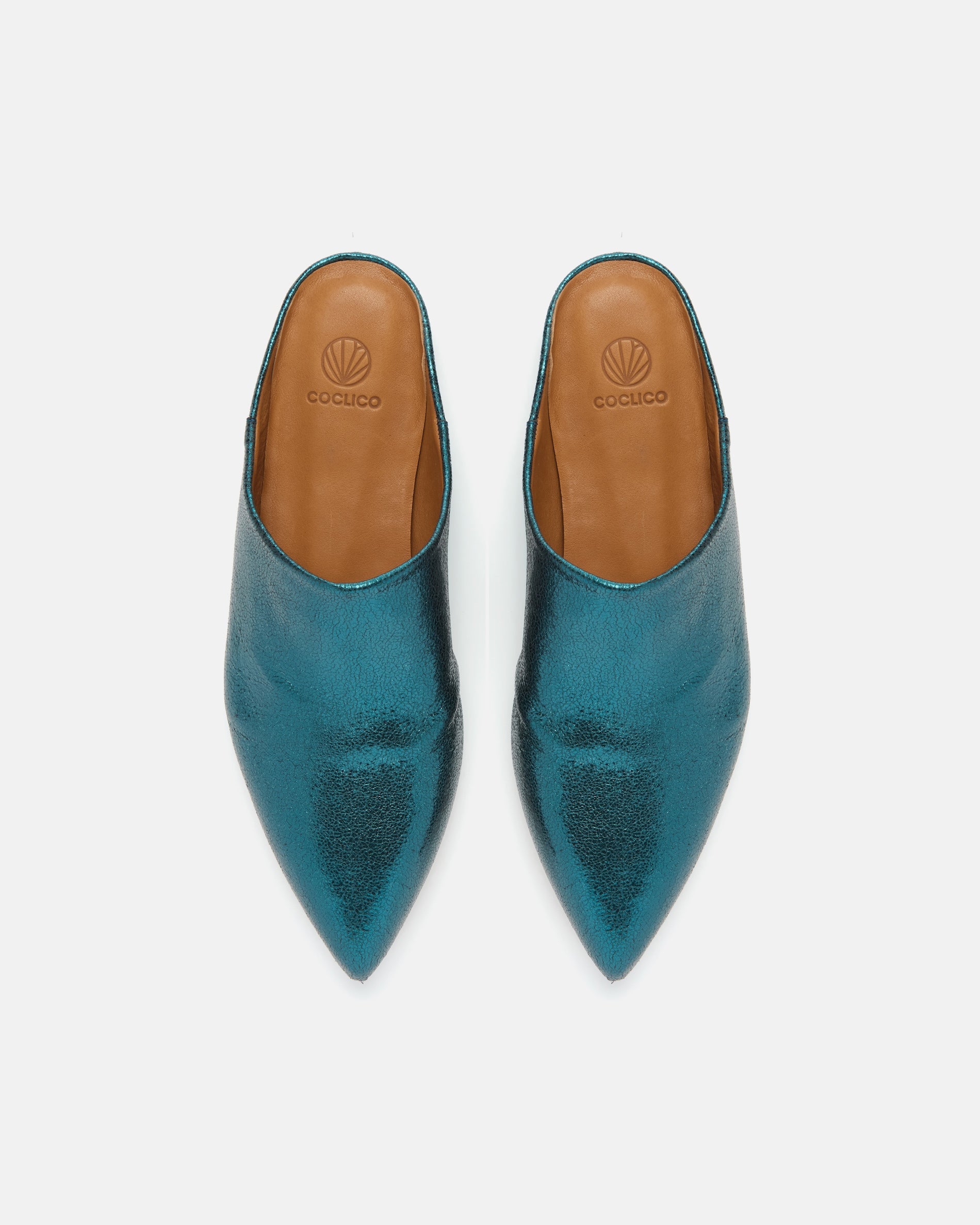 Top view of a blue metallic pointed-toe leather mule with a slight built-in wedge and clean minimalist silhouette on a white background