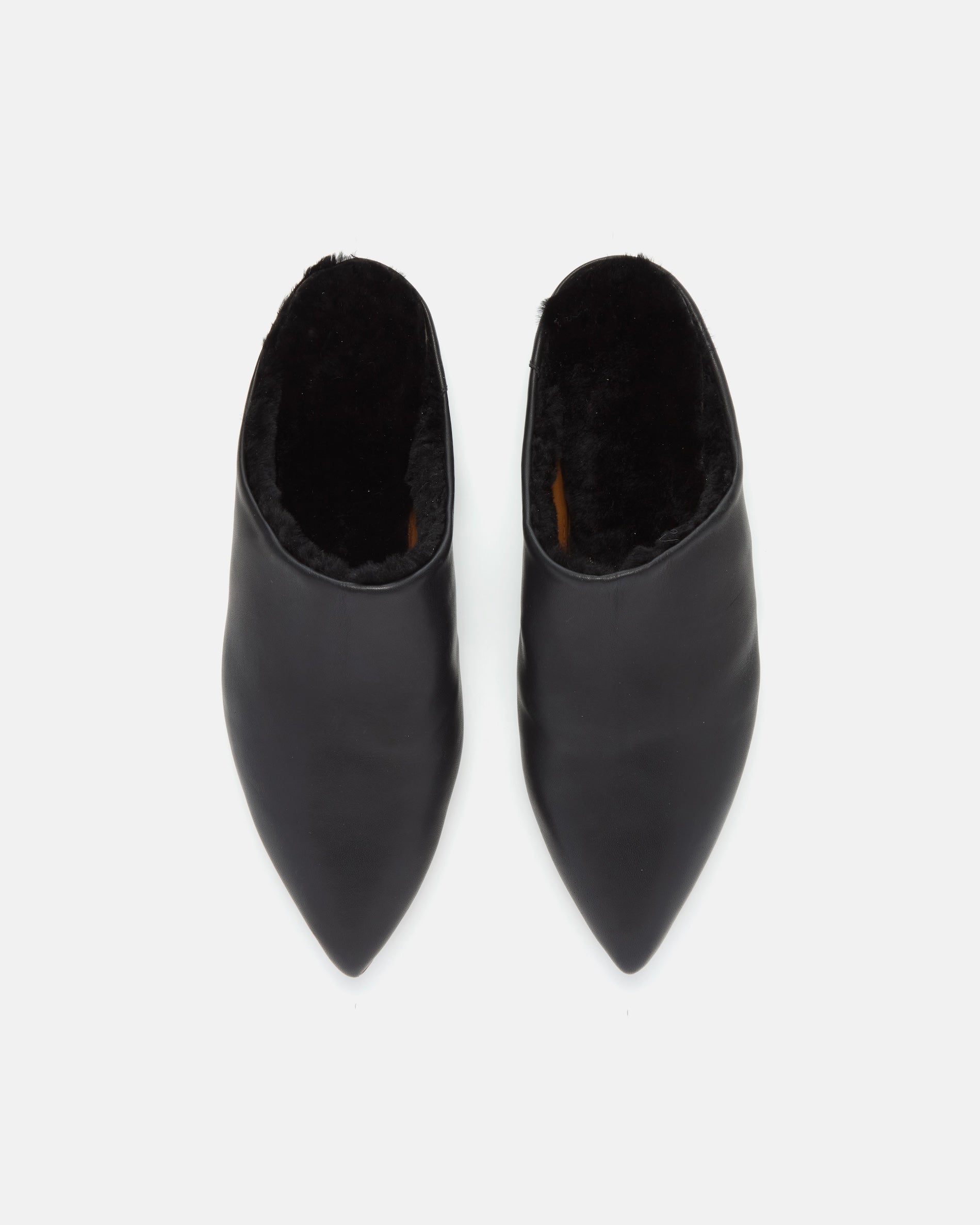 Pair of Coclico Dia Shearling Slides in black leather, top view of pointed toe mules