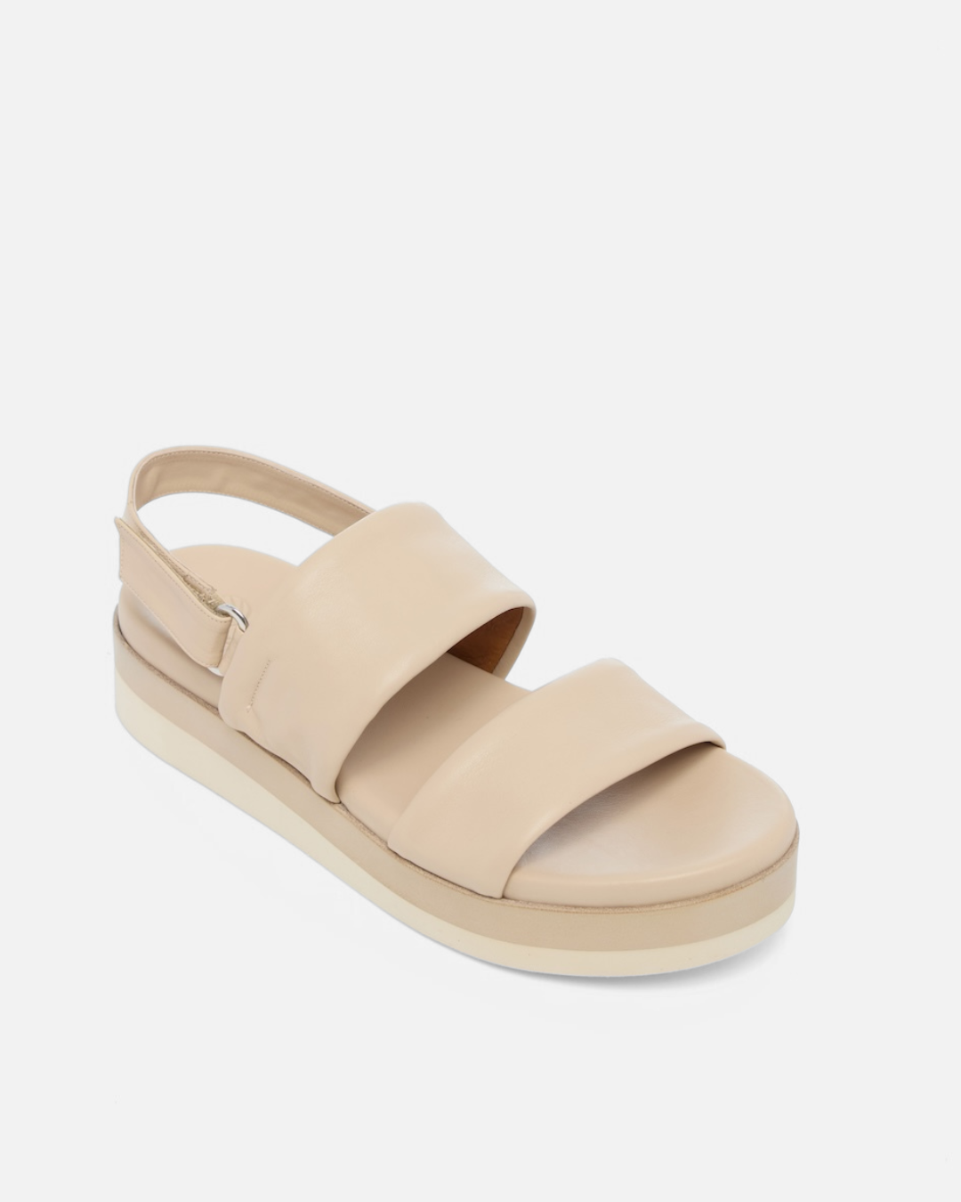 Angled view of a off-white leather wedge sandal with wide tubular straps, velcro slingback, and a lightweight EVA platform sole