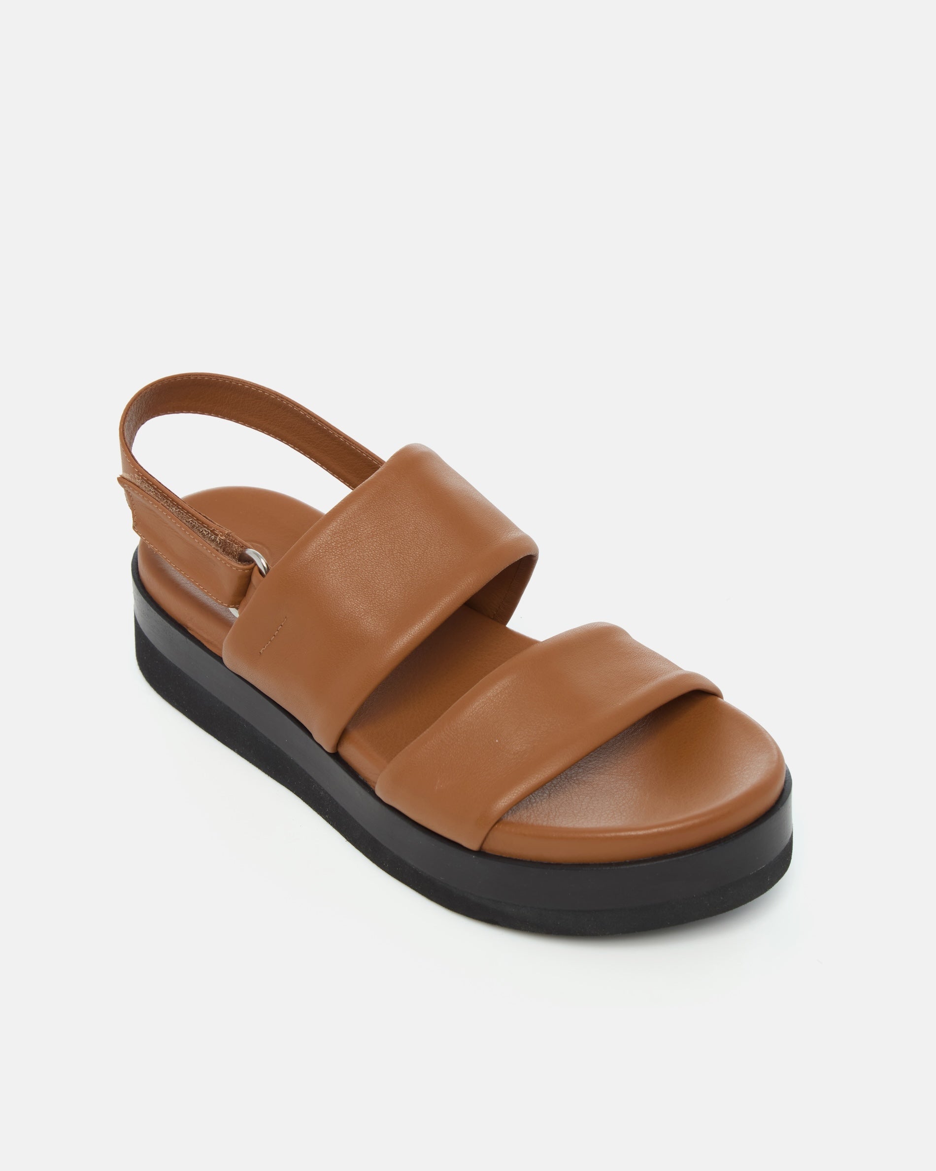 Angled view of a brown leather wedge sandal with wide tubular straps, velcro slingback, and a lightweight EVA platform sole