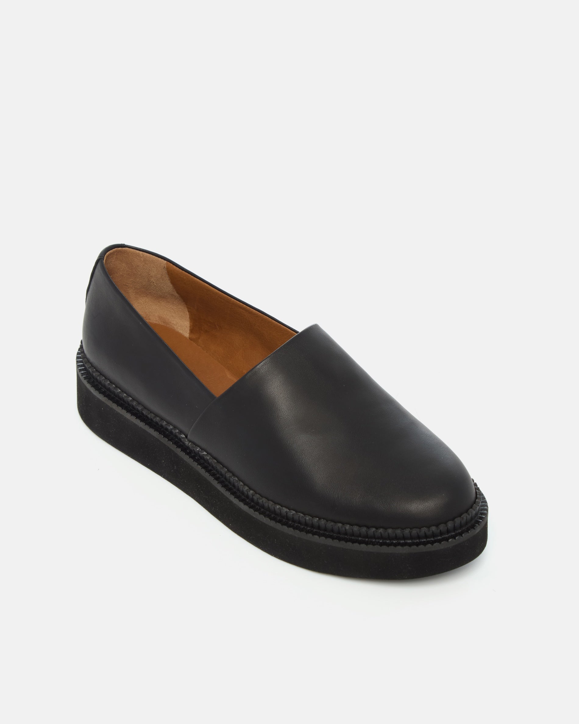 Coclico Ginsberg Loafer in black leather, angled view of the apron front and platform sole