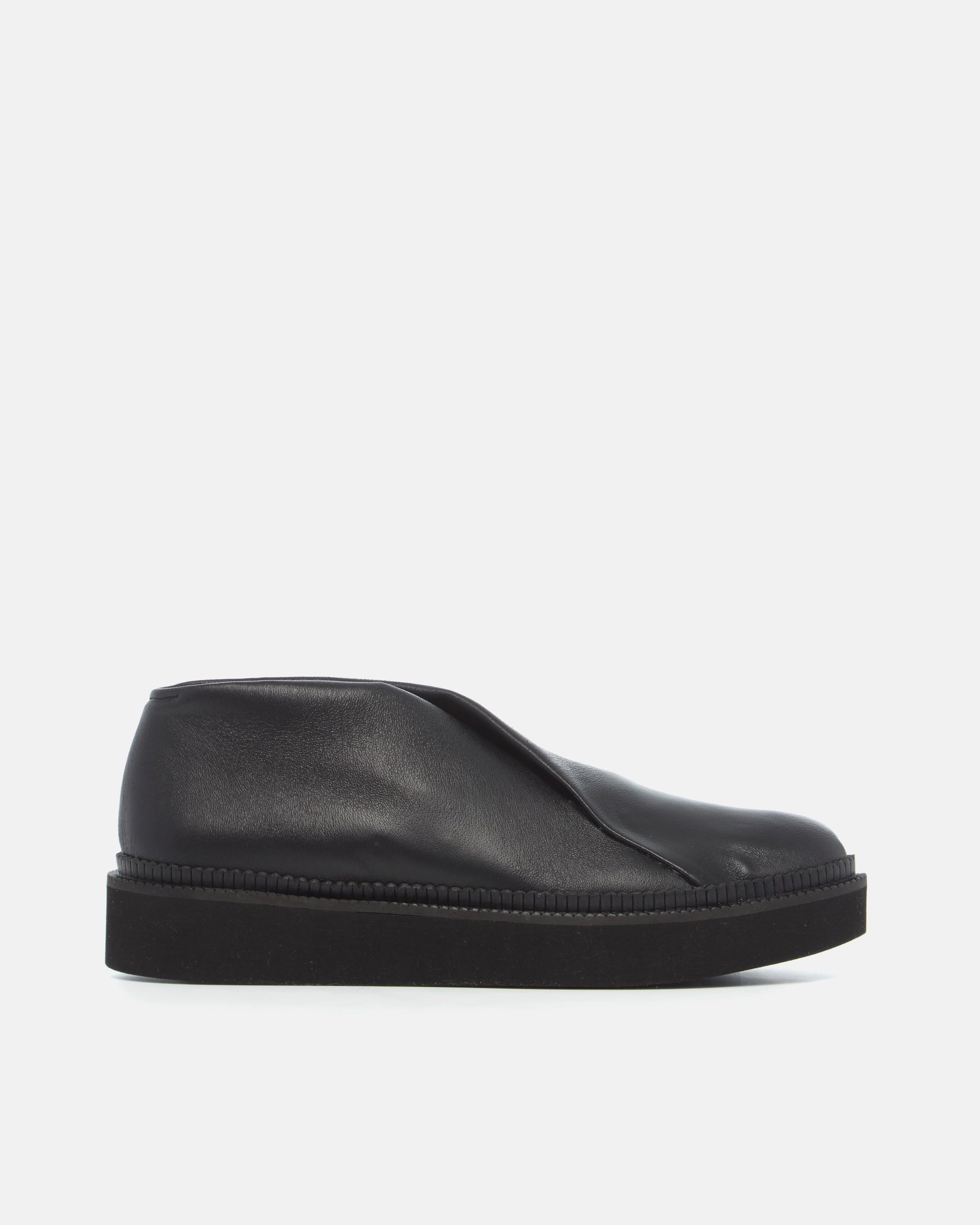 Coclico Grace Flatform in black stretch leather, side view of a crossover slip on