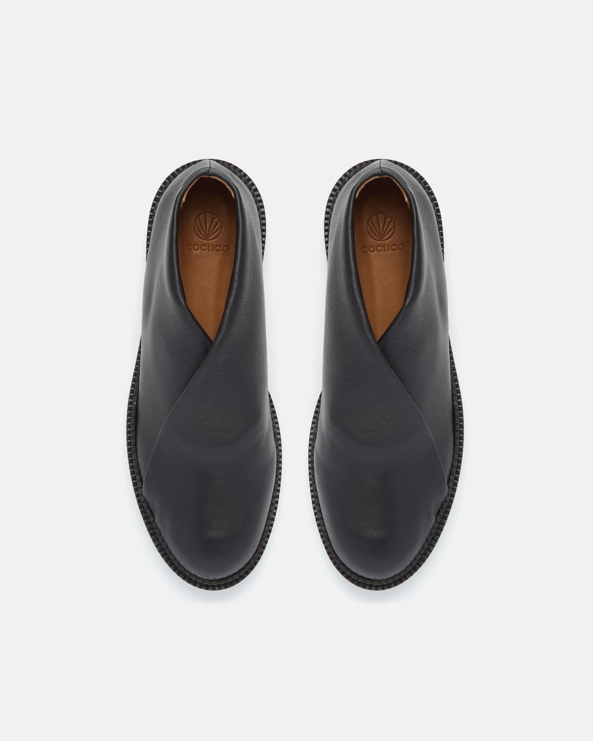 Pair of Coclico Grace Flatforms in black stretch leather, top view