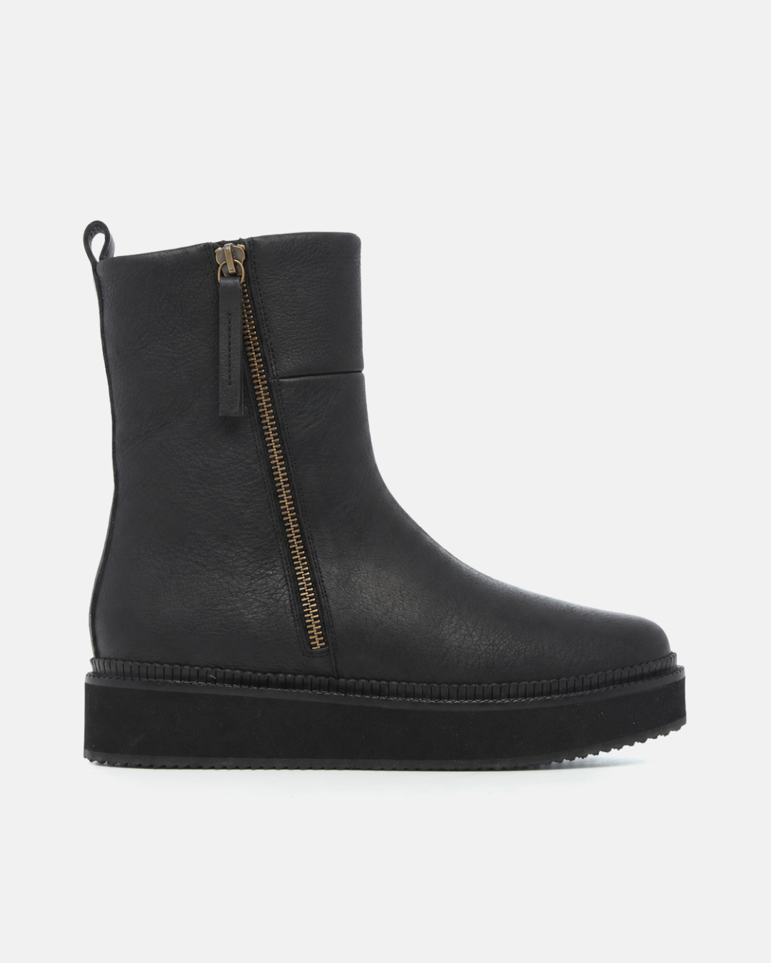 Black quilted boot with thick sole on a white background