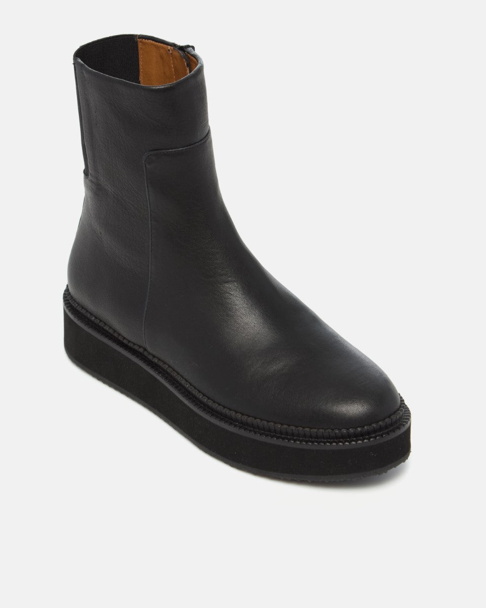 Coclico Greta Boot in black leather, angled view showing the back zip
