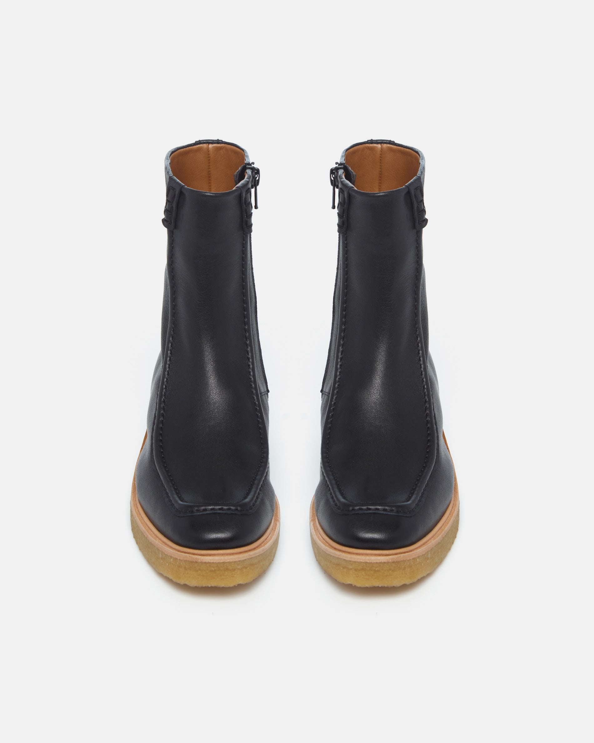 Pair of Coclico Haber Boots in black leather, back view of crepe wedge sole boots