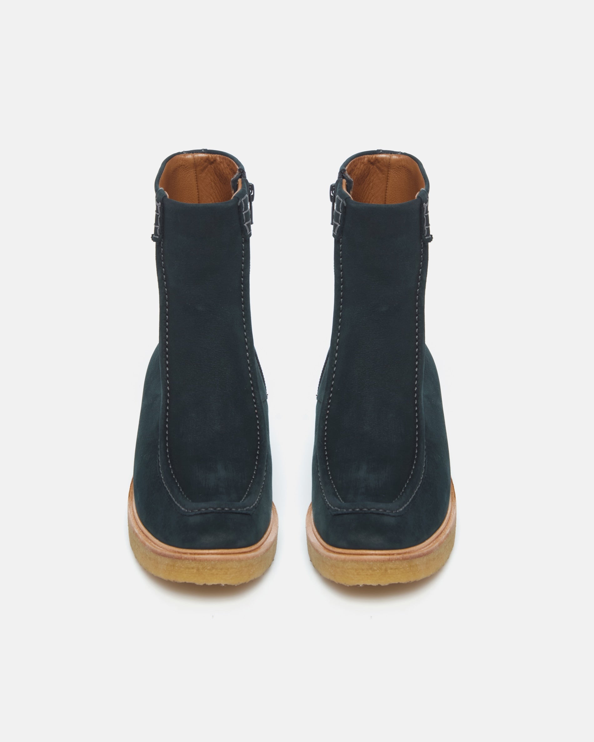 Pair of Coclico Haber Boots in Deep Sea nubuck, back view of navy crepe wedge sole boots