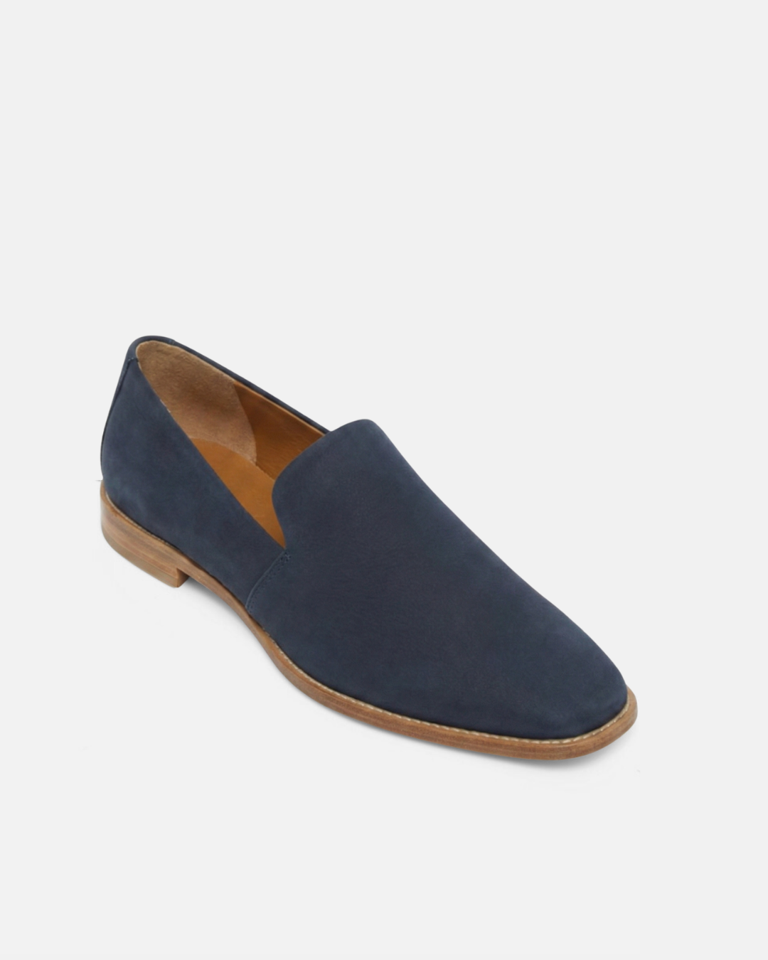 Angled view of a navy nubuck leather slip-on loafer with a tapered square toe and low stacked heel on a white background