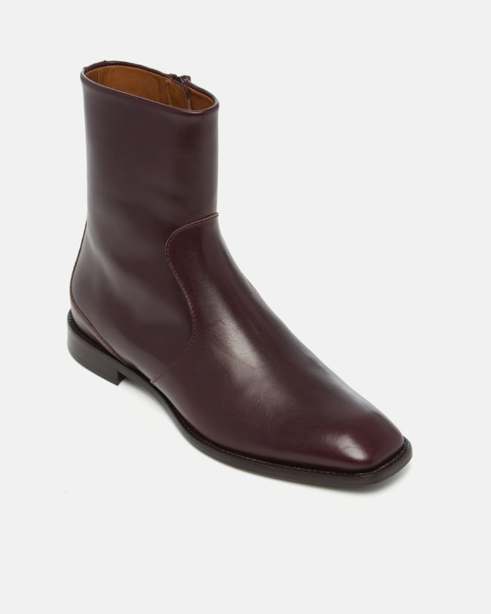 Coclico Hopper Boot in Oxblood leather, angled view of the square toe