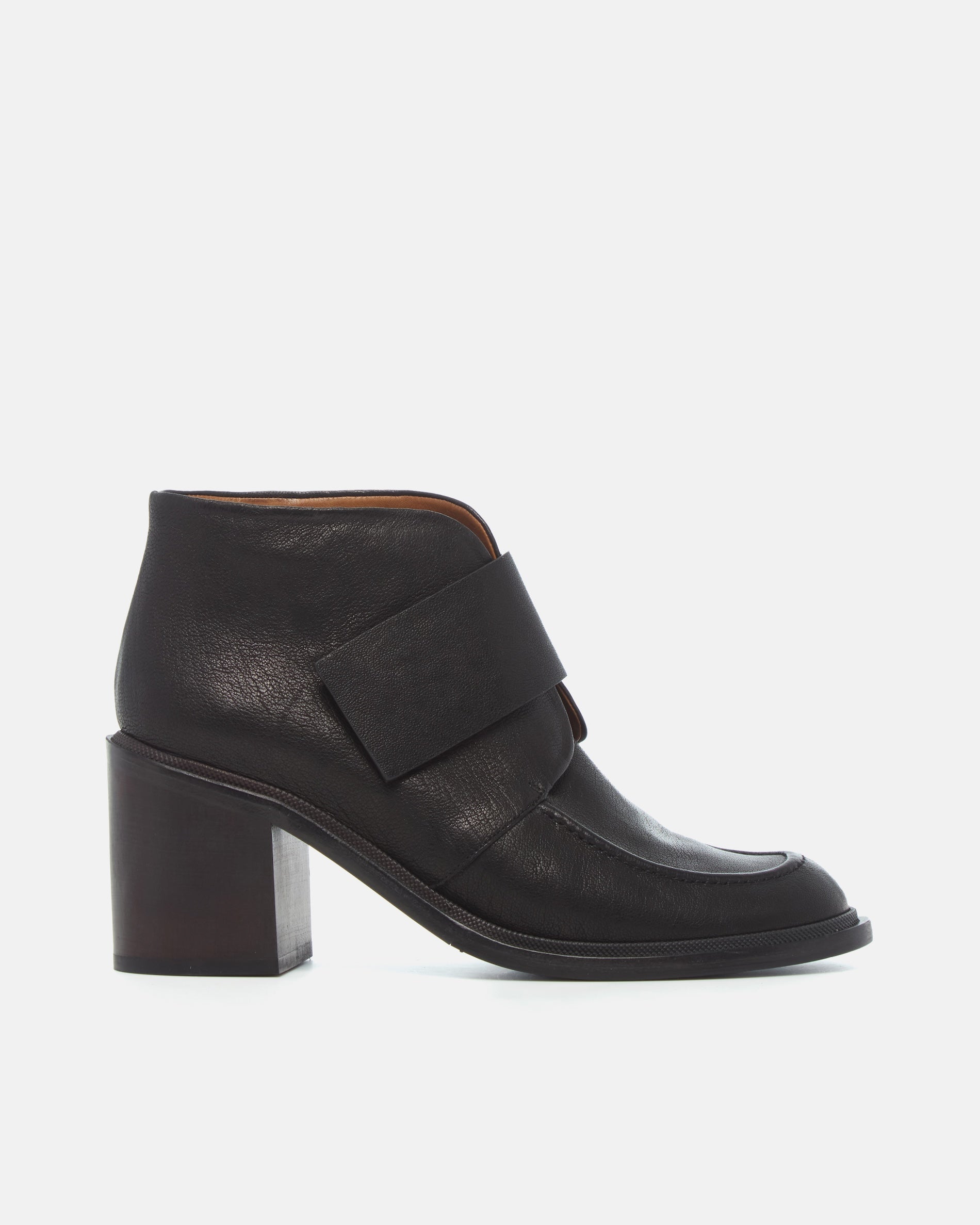 Coclico Lilya Boot in black leather, side view of an ankle boot with wide crossover strap and block heel