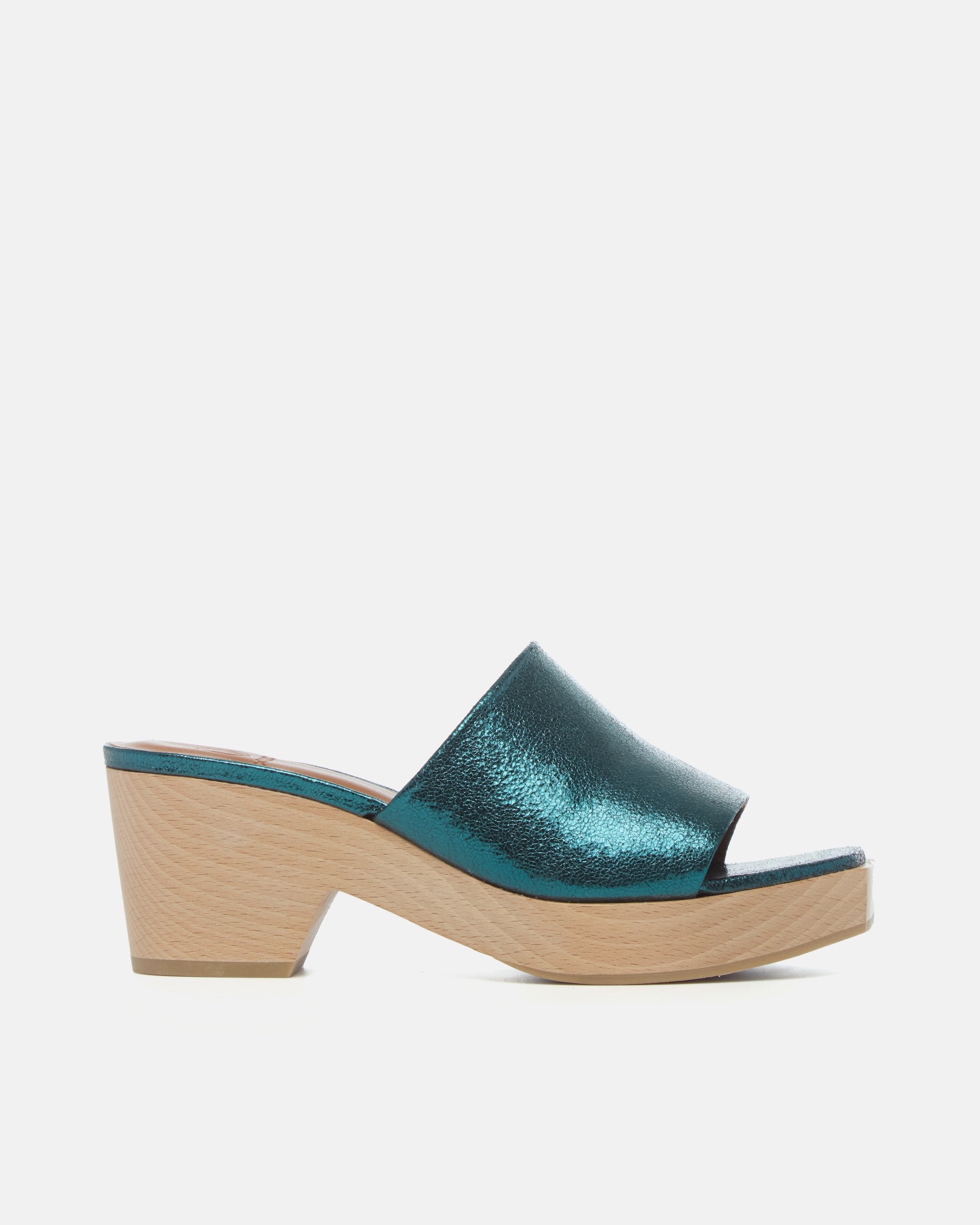 Side view of a metallic blue leather slide clog with a wide upper, squared toe, and solid ash wood sole