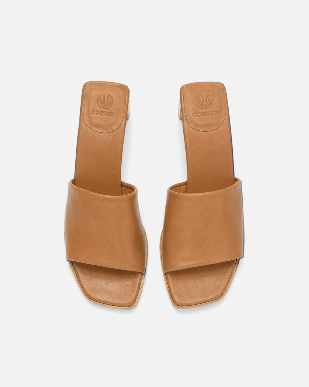 Top view of a wood mid-heel slide sandal in tan leather