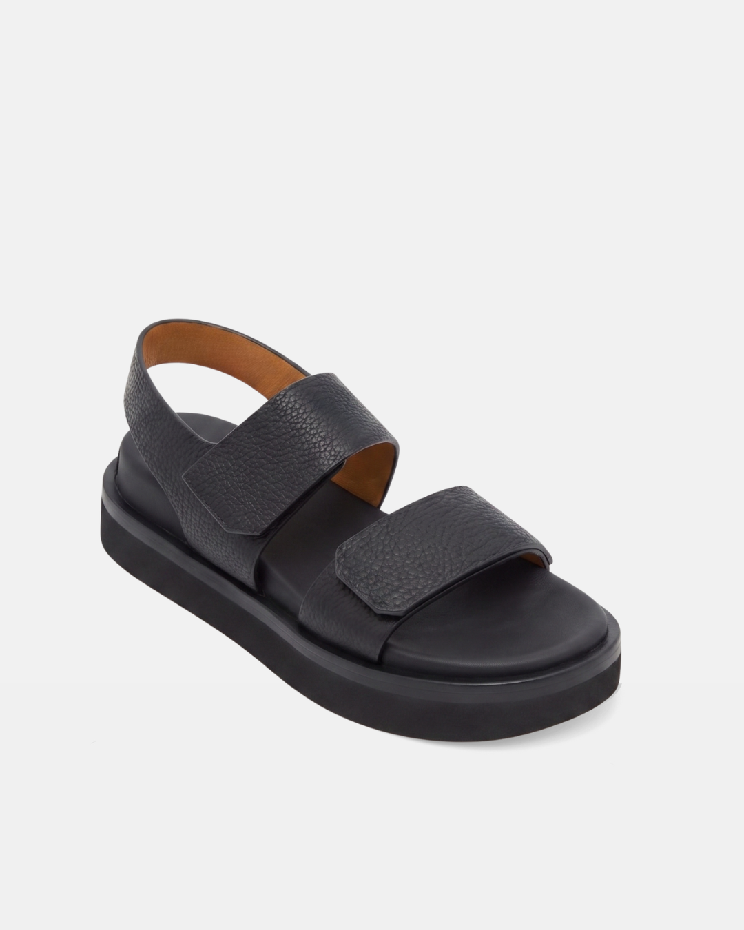 Angled view of a black wedge foot bed sandal with a wide front strap and wide quarter strap fastened by velcro