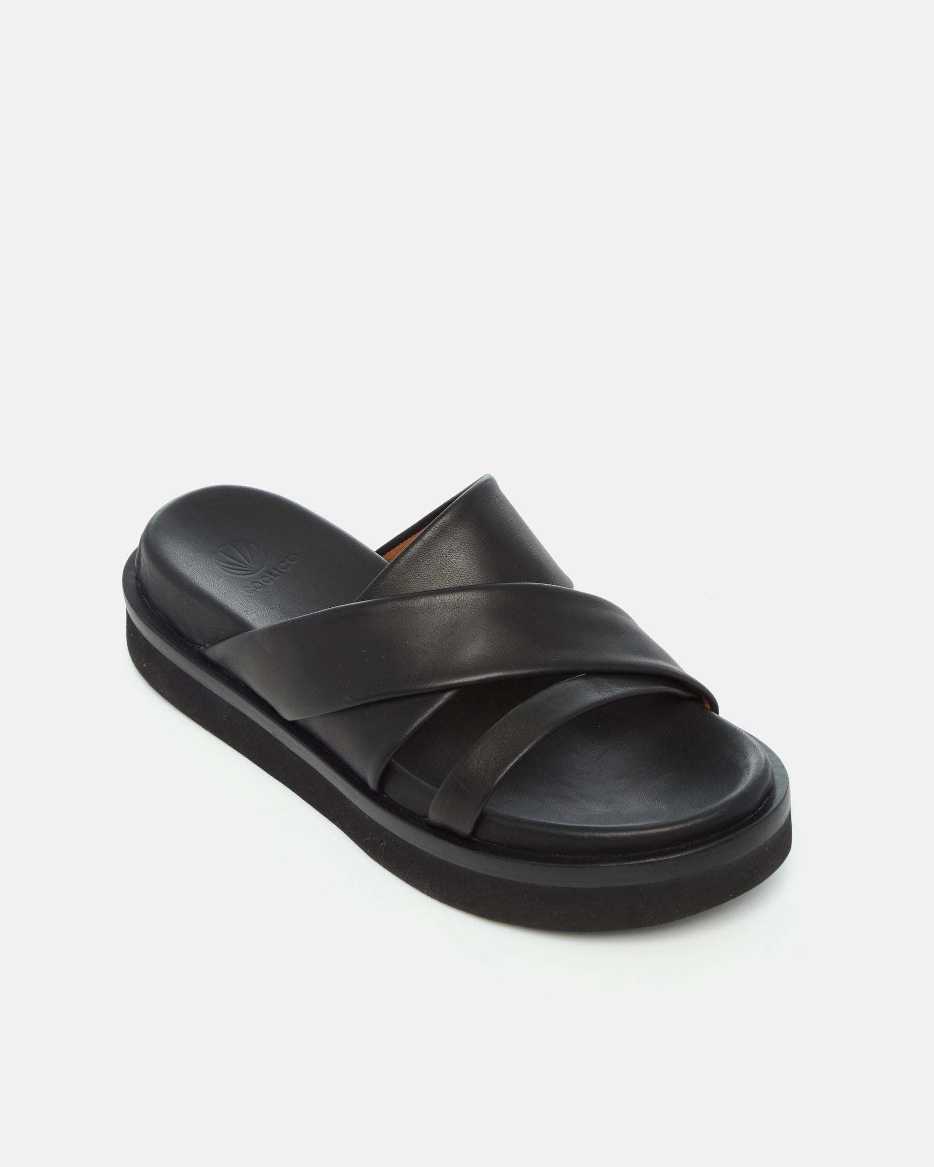 Angled view of a black leather footbed sandal with wide folded straps and a sleek cushioned platform sole