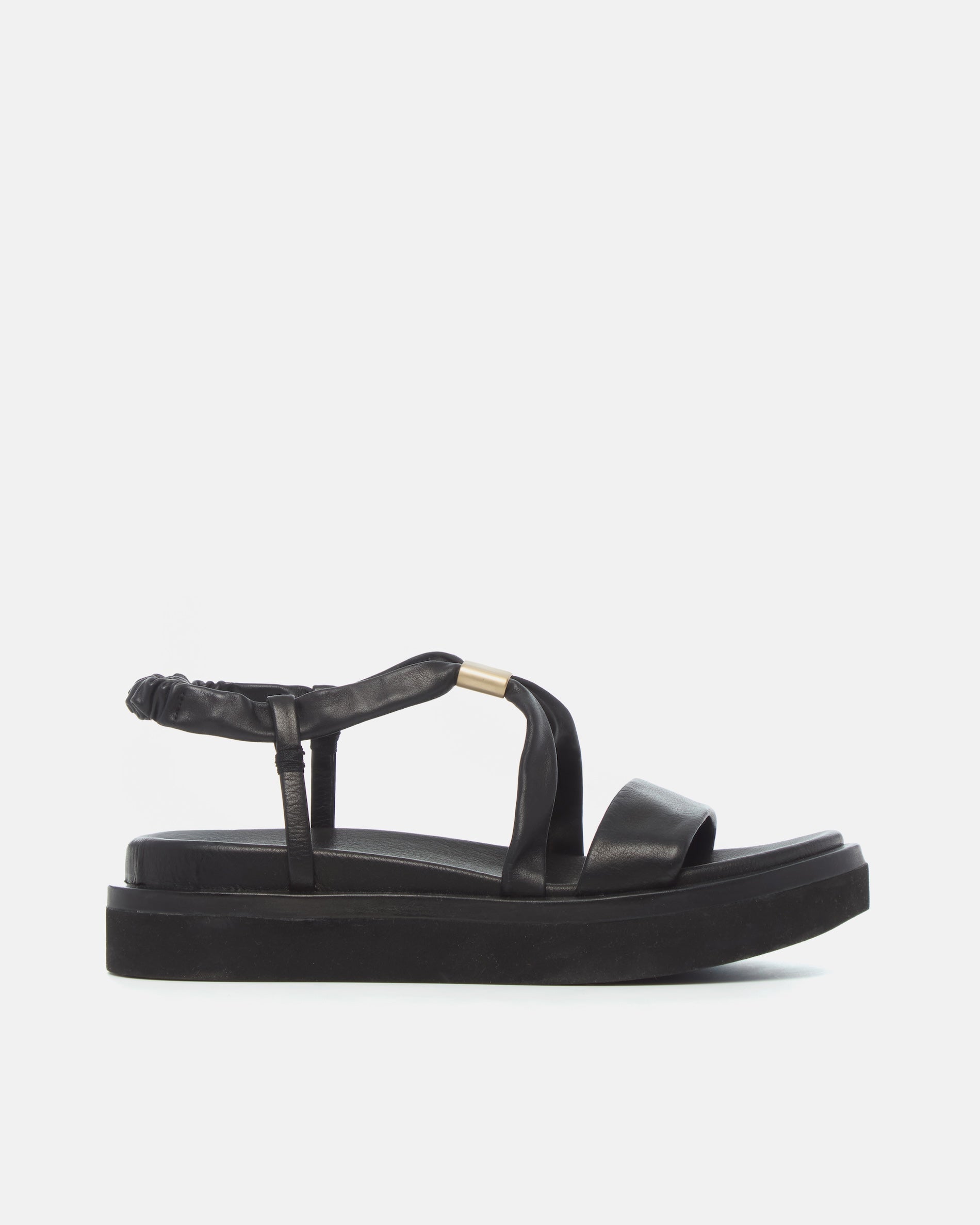 Side view of a black leather slingback sandal with soft tubular straps, brushed-metal keeper detail, and a cushioned platform sole on a white background