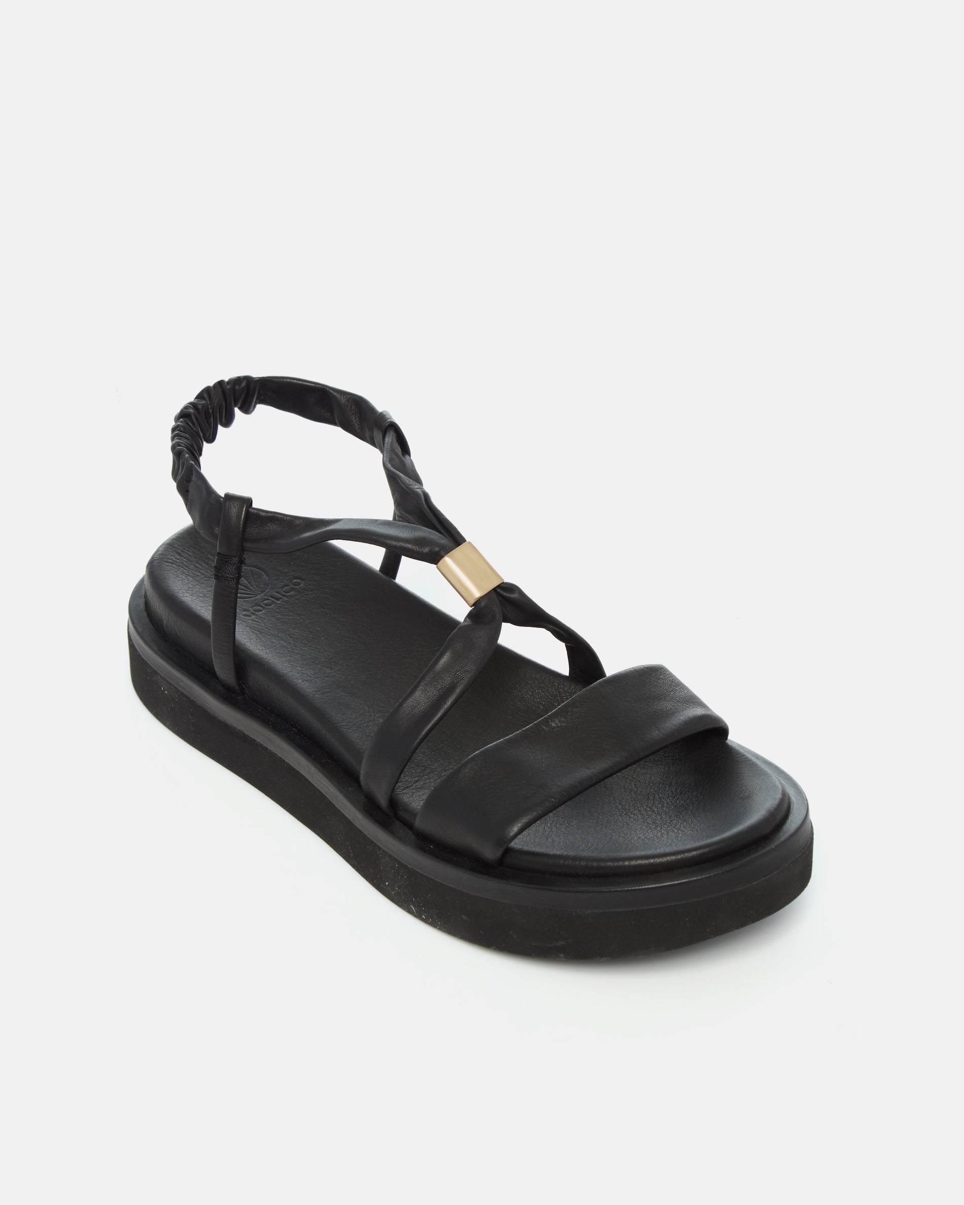 Angled view of a black leather slingback sandal with soft tubular straps, brushed-metal keeper detail, and a cushioned platform sole on a white background