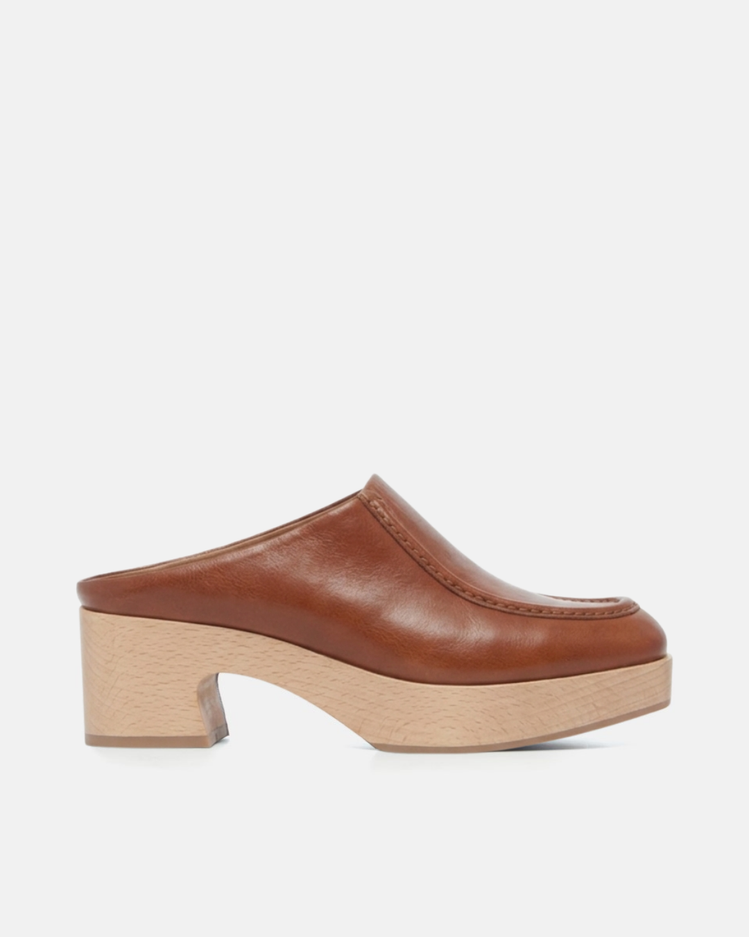 Coclico Qadira Clog in Cuero, a natural tan closed toe clog mule on a platform heel
