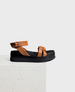 tubular, knotted, sandal with a thick ankle strap on a lightweight black flatform wedge 1