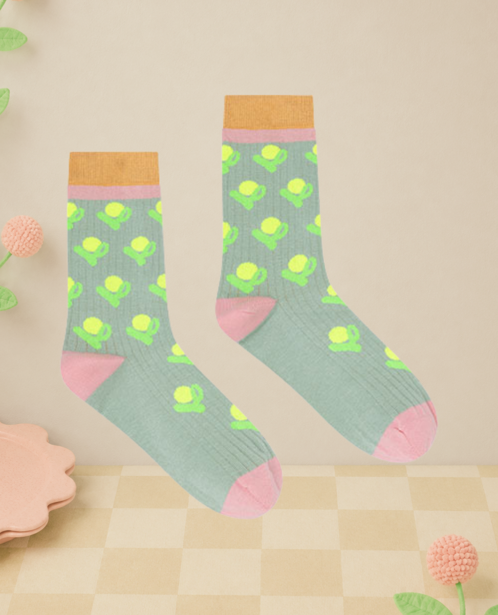 Dr Bloom Fleur Socks in Aqua, sage green ribbed knit socks with a neon flower pattern, pink heel and toe, and ochre cuff