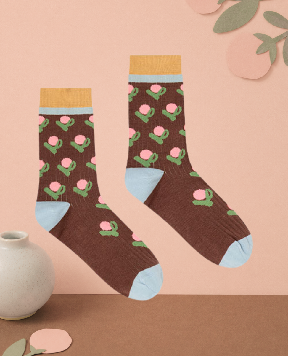 Dr Bloom Fleur Socks in Brown, chocolate ribbed knit socks with a pink flower pattern, sky blue heel and toe, and ochre cuff
