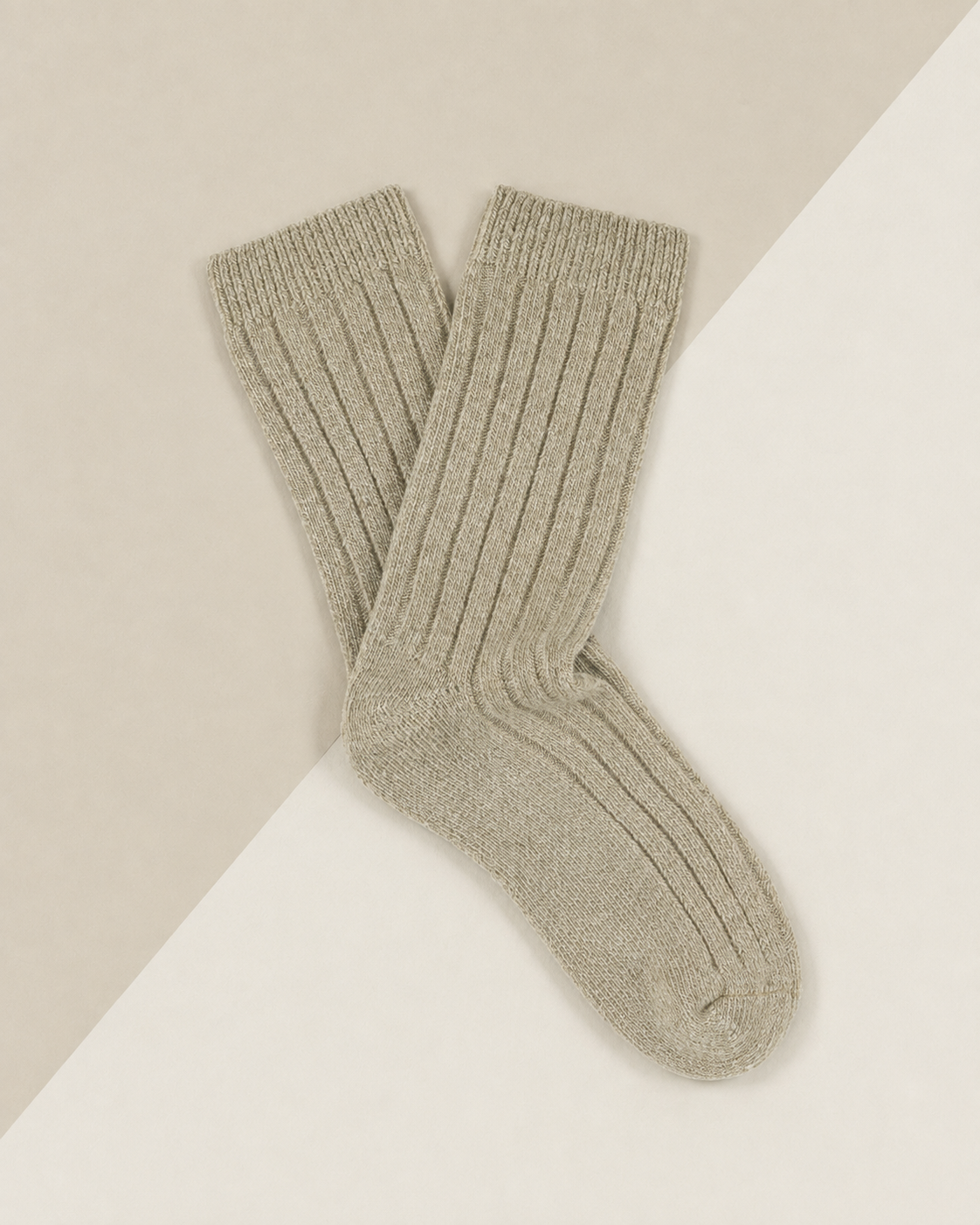 Escuyer women's cashmere crew socks in beige on a two-tone cream background